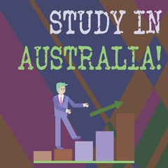 Writing note showing Study In Australia. Business concept for going into foreign country order complete your studies Smiling Businessman Climbing Bar Chart Following an Arrow Up