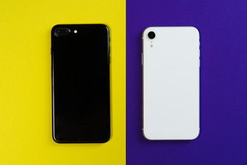 Two Smartphone Yellow Purple Background Flat Lay