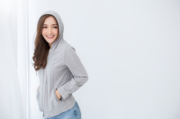 Portrait of beautiful asian woman wearing hooded relax at home in winter or summer. Smile happy...