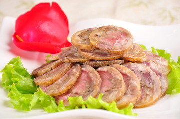 meat with vegetables on white plate