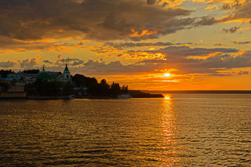 Naklejka premium July 5, 2014: Sunset sun on the embankment of the Volga River near the city of Cheboksary. Cheboksary. Russia.