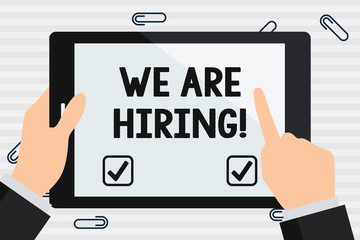 Handwriting text We Are Hiring. Conceptual photo recently you employ someone or pay someone to do particular job Hand Holding Pointing Touching Blank Rectangular Color Tablet White Screen