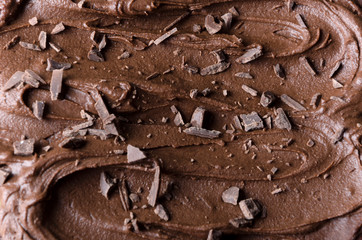 Closeup of melted chocolate and chocolate chips on top of it