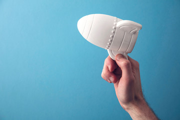 Launch a new business concept. Hand holding a space rocket. Startup business