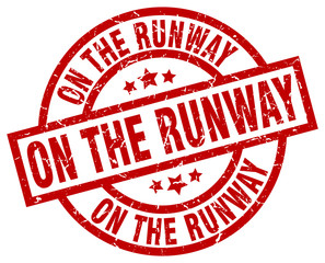 on the runway round red grunge stamp