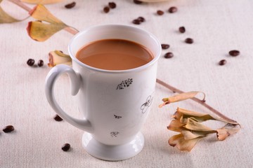 cup of coffee and cookies on wooden table