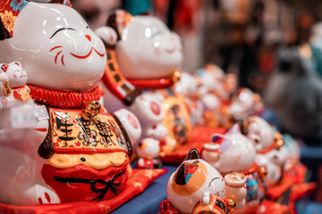 Chinese low quality production.  Fortune cats. Oriental souvenirs, mass produced for international export and trade. 