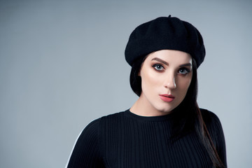 Portrait of brunette girl in beret