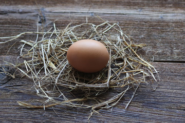 chicken egg on an old wooden table.