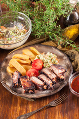 Spicy barbecued pork ribs with french fries