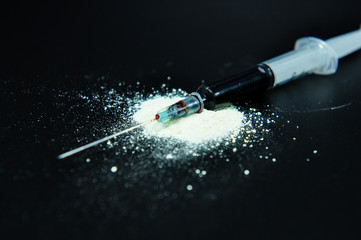 drug syringe and cooked heroin