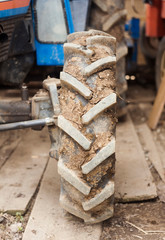 closeup of tractor wheel with dirt