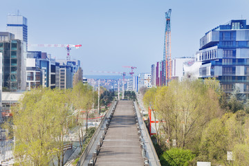 Obraz premium Parisian cityscape with skyscrapers and cranes, France