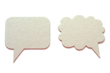 Two gray cardboard speech bubbles isolated on white..