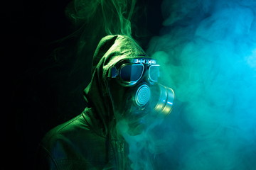 Military gas mask for protection. Fireman inside the smoke.Terrorism,war and pollution...