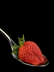Strawberry in spoon