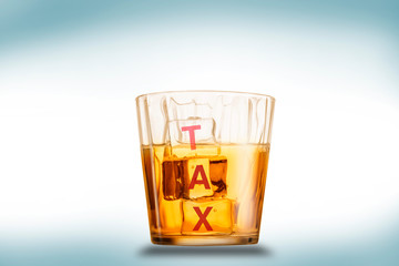 Tax on ice cubes in a glass of water. The tax burden is increasing along with increasing income and wealth.