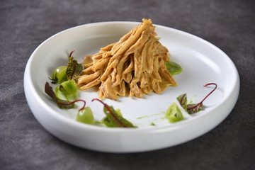 pasta with pesto sauce and basil