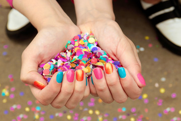 Colorful colorful manicure with confetti.Nail design.