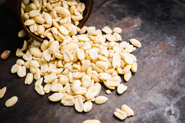 Roasted and salted peanut in bowl. Selective focus. Shallow depth of field.