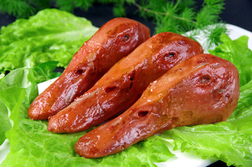 sausages on plate with salad