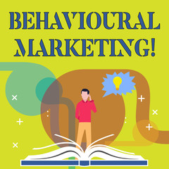 Conceptual hand writing showing Behavioural Marketing. Concept meaning targets consumers based on their behavior on Web sites Man Standing Behind Open Book Jagged Speech Bubble with Bulb