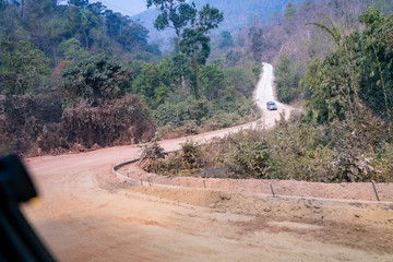 Difficult gravel road in the mountain of Thailand