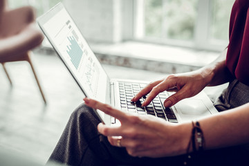 Smart psychologist checking some statistics in the Internet