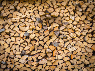 A stack of firewood - wooden abstract horizontal background