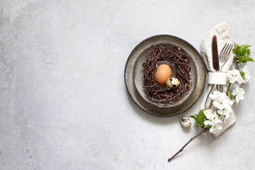 Table setting for happy Easter in rustic style.
