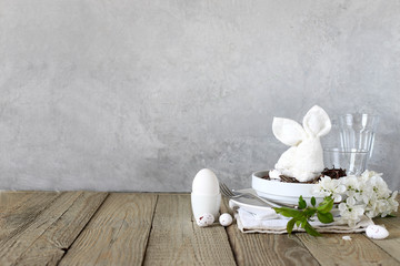 Table setting for happy Easter in rustic style.