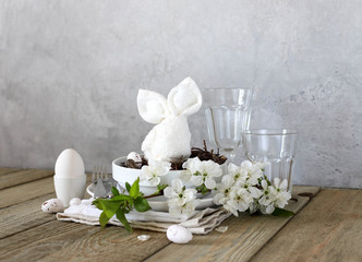 Table setting for happy Easter in rustic style.