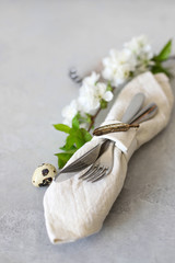 Table setting for happy Easter in rustic style.