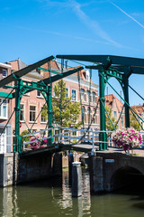 green lifting bridge Kerkburg, across canal, Leiden, The Netherlands