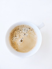 Hot coffee on white table, top view photo 