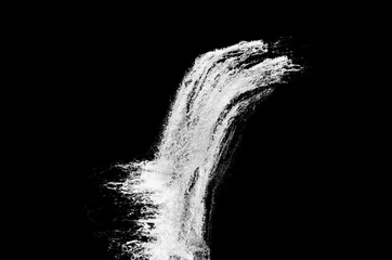 Foto op Canvas waterval geïsoleerd op de zwarte achtergrond © NAPAPORN