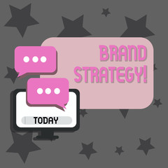 Fototapeta premium Writing note showing Brand Strategy. Business concept for long term plan development of successful brand achieve goals Monitor and Two Speech Balloon with Three Dots for Chat Icon