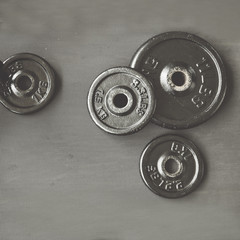 Obraz premium dumbbell and barbell on floor at gym