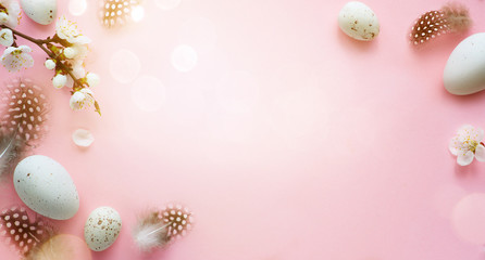 Easter background; Easter Eggs with spring Flowers on pink Background