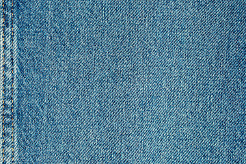 Beautiful blue denim fabric close up. Can be used as a background.
