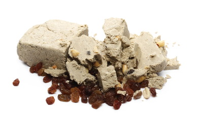 Halvah with raisins and peanuts isolated on white background