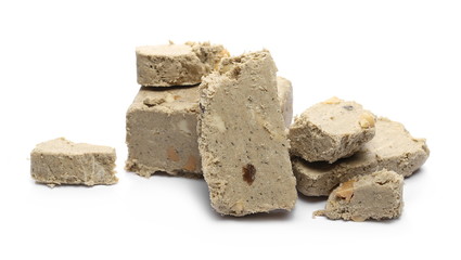 Halvah with raisins and peanuts isolated on white background