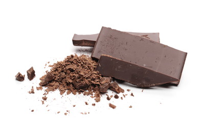 Chocolate bars, pieces with shavings isolated on white background
