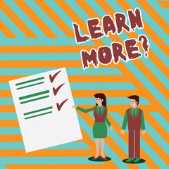 Writing note showing Learn More question. Business concept for gain knowledge or skill studying practicing Man and Woman Presenting Report of Check and Lines on Paper