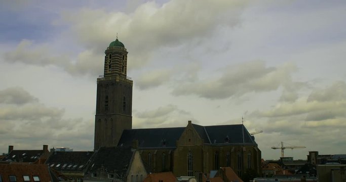 skyline old city clock tower church timelaps clouds