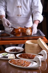 woman cutting vegetables in kitchen