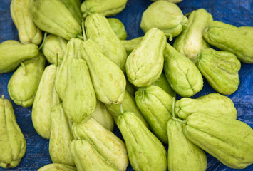 Chayote fruit on ground for sale in the local market asia / Sechium edule