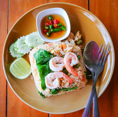 Fried rice chicken egg with shrimp and vegetable carrot chinese kal on plate