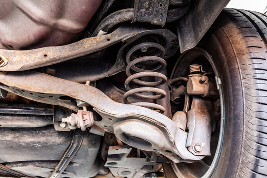 Used vehicle shock absorber and control arm in a repair shop