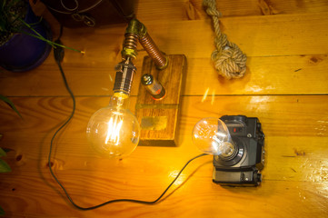 Light fixtures handmade in vintage style, retro film SLR camera case and wooden case